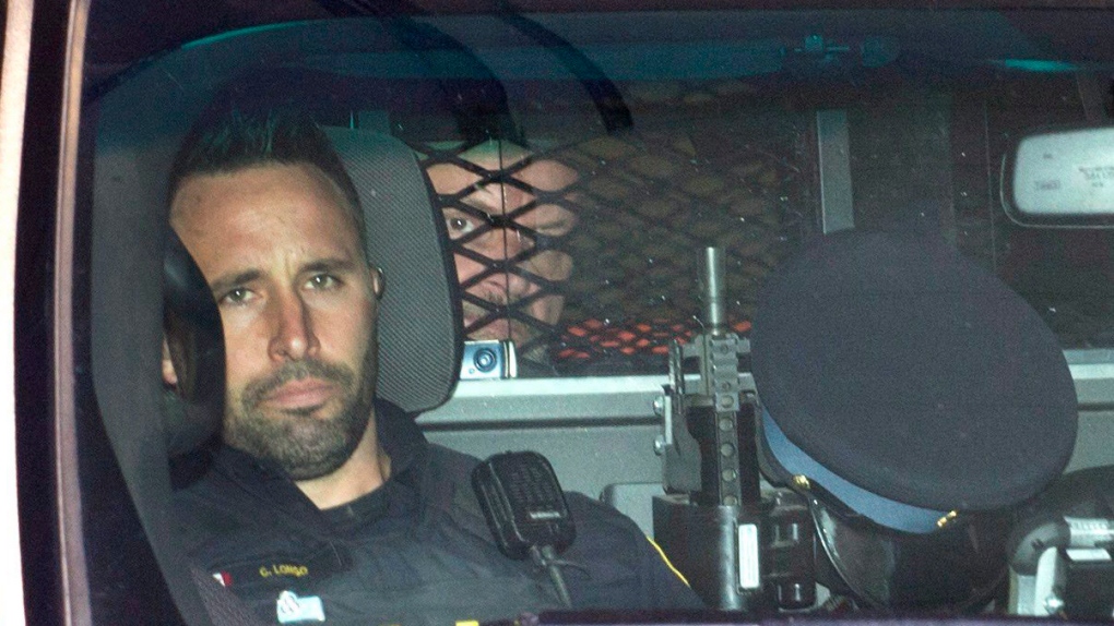 Basil Borutski leaves in a police vehicle