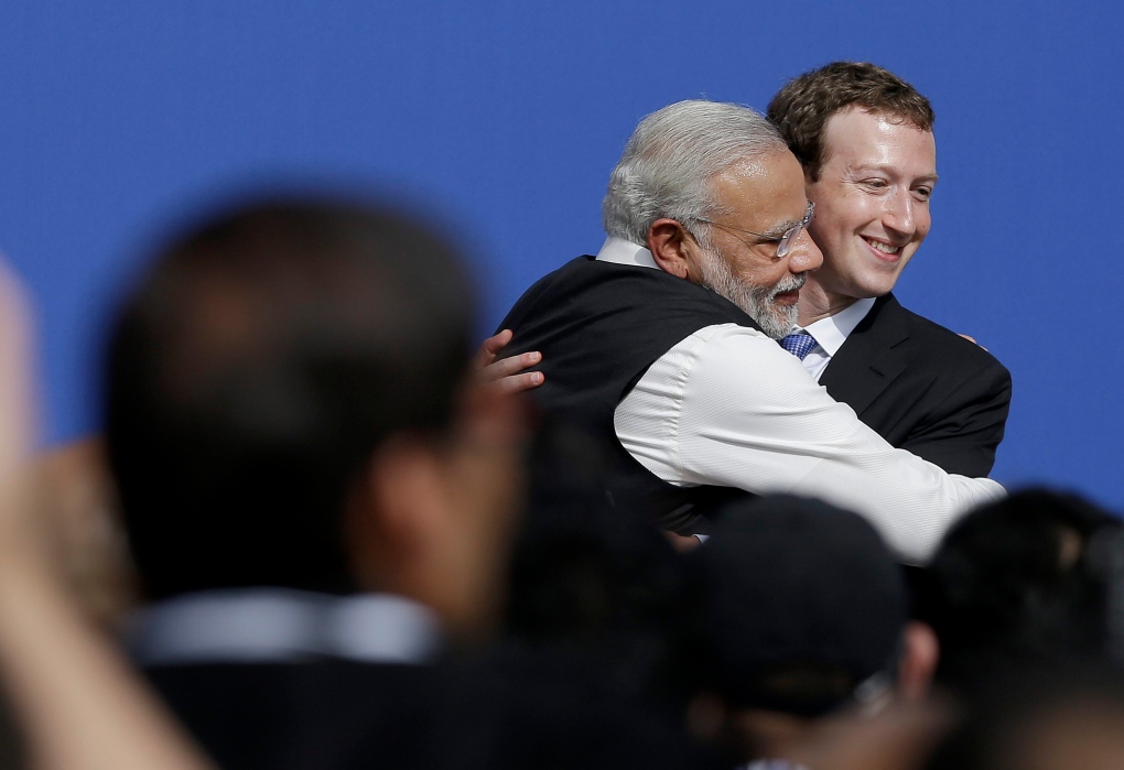 Indian PM Modi hugs Facebook CEO Zuckerberg