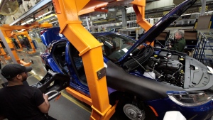 In this March 14, 2014, file photo, an assembly line worker builds a 2015 Chrysler 200 automobile at the Sterling Heights Assembly Plant in Sterling Heights, Mich. Fiat Chrysler's U.S. sales jumped 14 percent in September 2015, helped in part by another strong month from the carmaker's Jeep brand. (AP / Paul Sancya)
