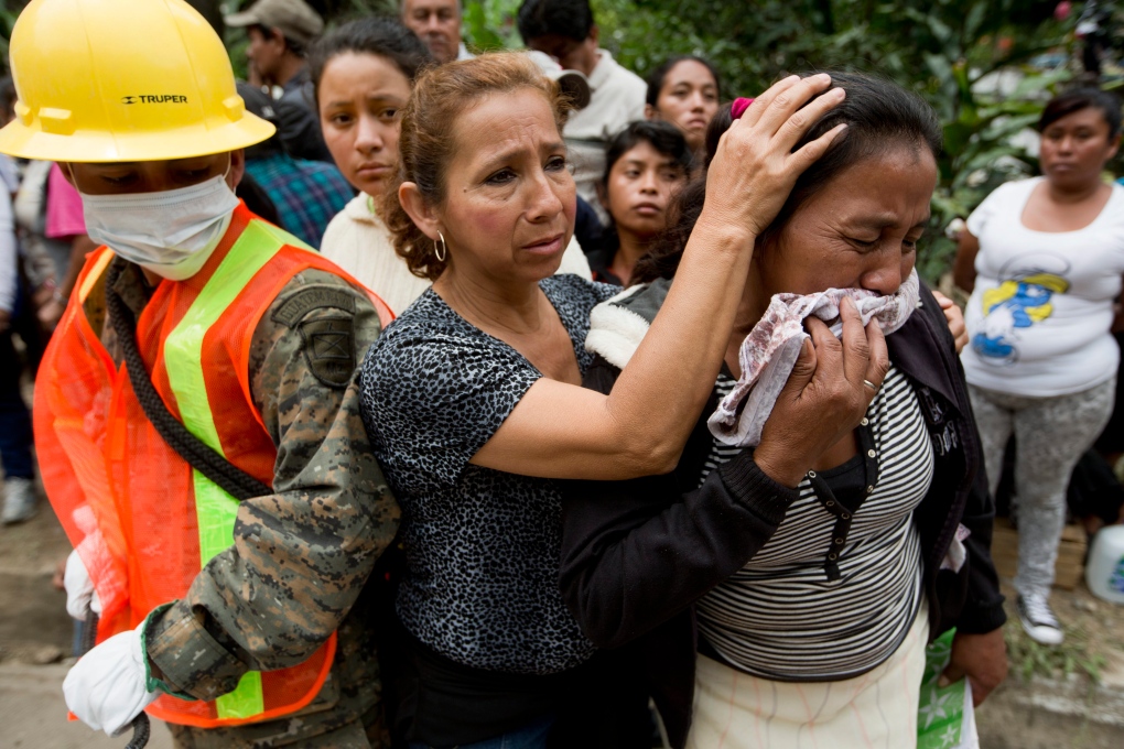 Guatemala residents wait for mudslide news 