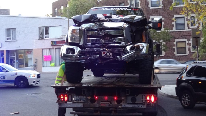 A truck is prepped to be towed away from the scene of a collision involving Montreal Canadiens winger Zack Kassian Sunday, Oct. 4 2015. Kassian, the female driver and a female passenger all sustained non-life-threatening injuries in the crash. (Twitter/@stevenp57)