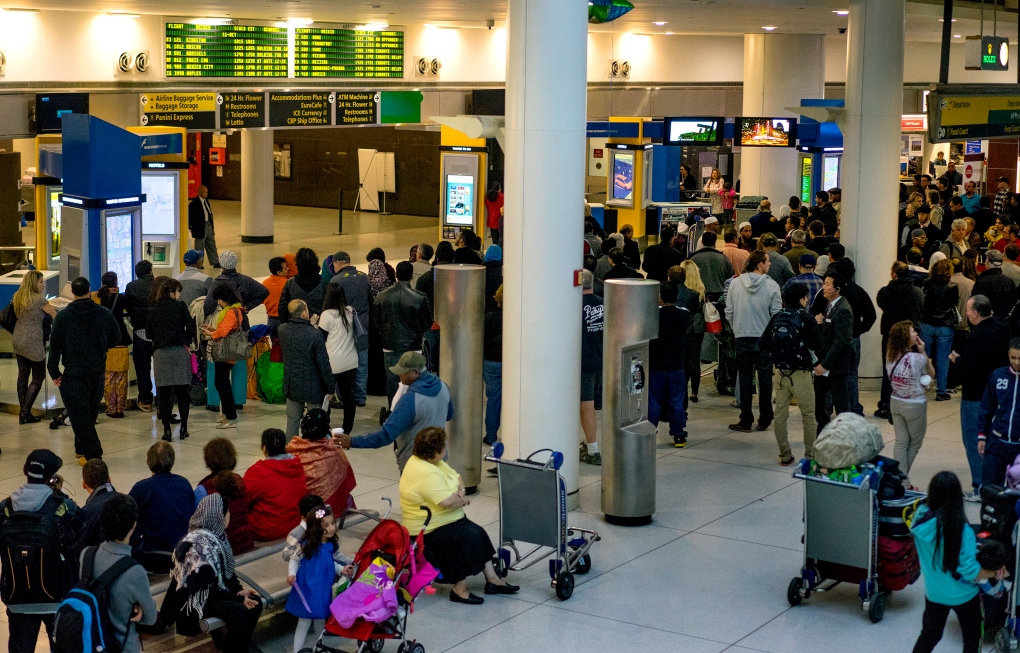 Passengers wait at JFK airport