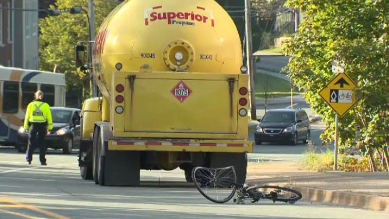 Police say a female cyclist has died after she was struck by a propane truck in Halifax Wednesday morning.