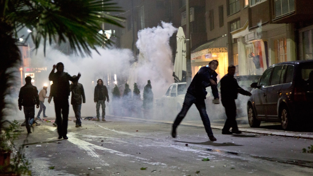 Protesters throw stones in Pristina