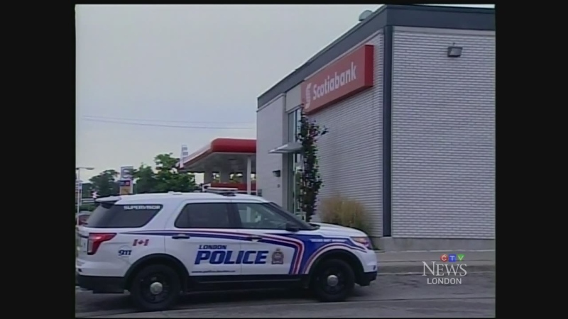 A police cruiser sits outside the Scotia Bank location at 950 Hamilton Rd. in London, Ont. after an armed robbery on Friday, Sept. 18, 2015.