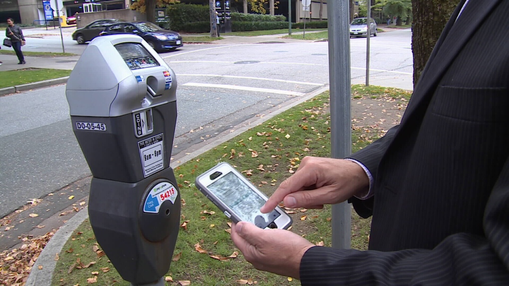 Man uses pay by phone parking on Vancouver street