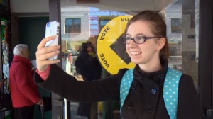 A voter takes a selfie after voting in Winnipeg on Oct. 19, 2015 in the federal election.