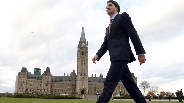 Prime Minister-designate Justin Trudeau makes his way from Parliament Hill to the National Press Theatre to hold a press conference in Ottawa on Tuesday, Oct. 20, 2015. (Sean Kilpatrick / THE CANADIAN PRESS)