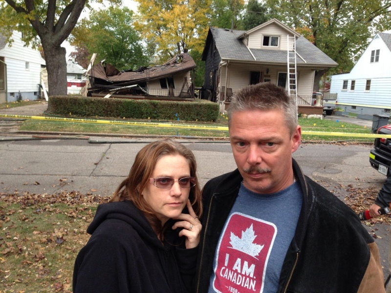 Bill and Susan Lariviere are devastated after a fire next door spread to their home in Windsor, Ont., on Wednesday, Oct. 21, 2015. (Sacha Long / CTV Windsor) 