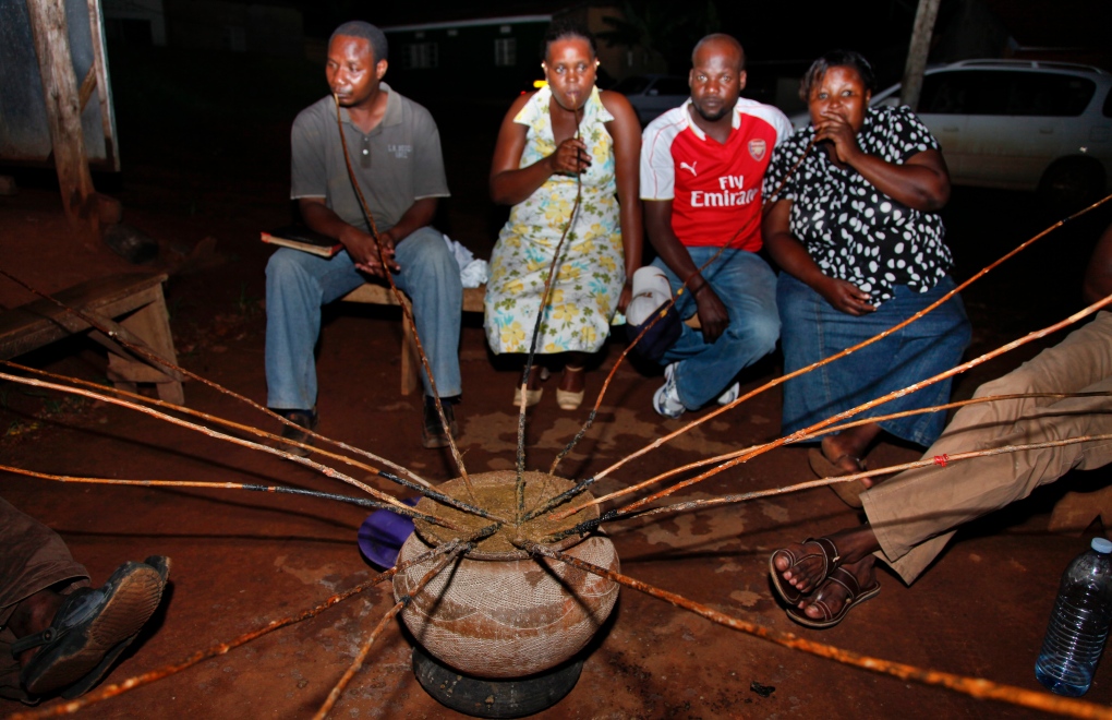 Ugandans drinking malwa