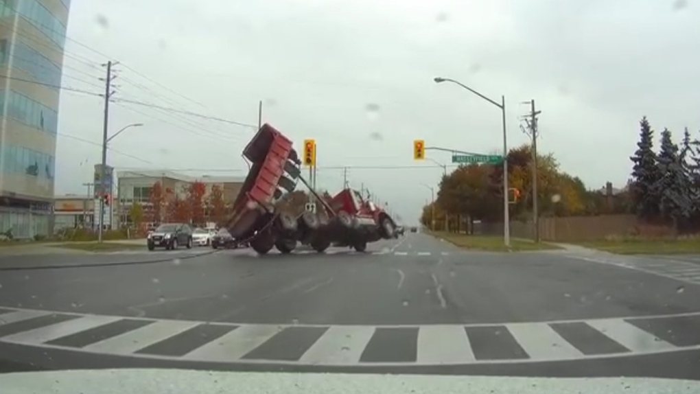 Dump truck with raised bed causes carnage at M