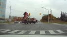 Dashcam video posted to YouTube shows a dump truck making a left at the intersection of Warden Avenue and Gibson Drive when the truck’s upright bed clips overhead power wires. (Frank Yu / YouTube)