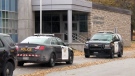 Police vehicles are seen outside Listowel District Secondary School on Thursday, Oct. 29, 2015.