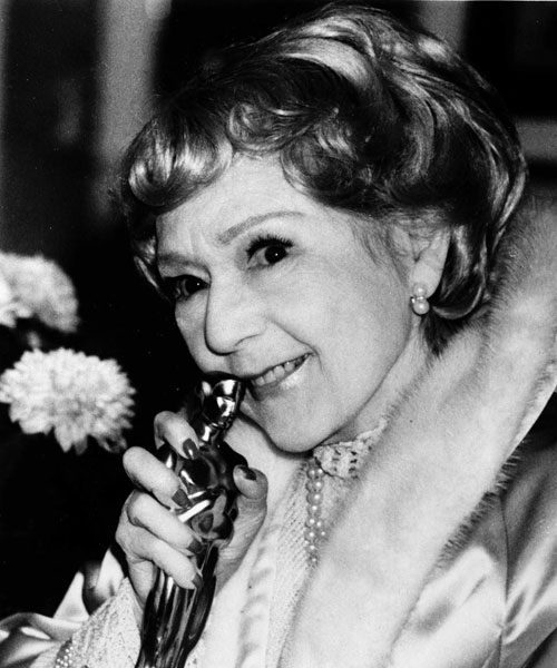 In this March 26, 1976 photo, actress Mary Pickford, 83, a star of Hollywood's silent film era, holds the Honorary Oscar given to her in recognition of her contributions to the film industry, at her home in Beverly Hills, Calif., March 26, 1976. (AP Photo)