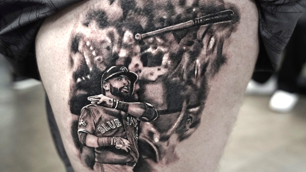 Fan who got Jose Bautista 'bat flip' tattoo has no regrets