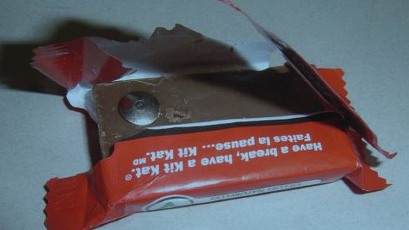chocolate bar with a tack through it