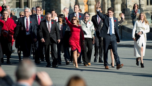 Prime Minister Justin Trudeau walks with cabinet