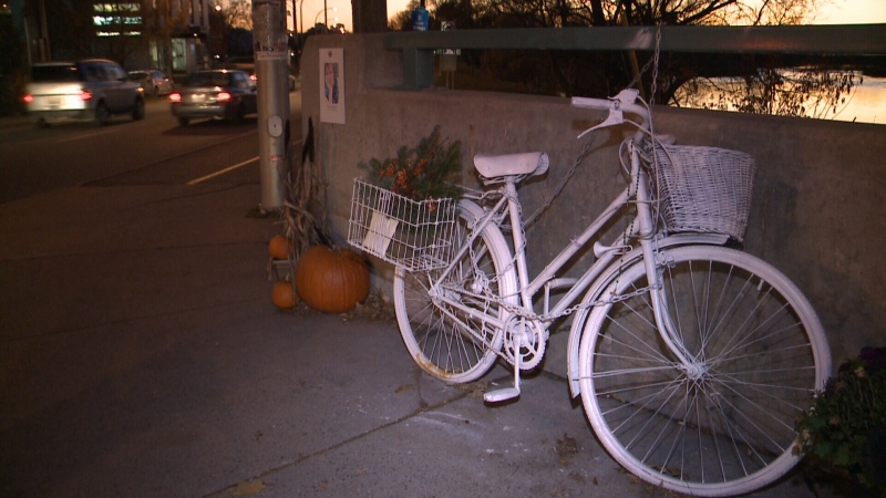 A ghost bike sits at the corner of Bank St. and Riverside Dr. in honour of Meg Dussault, a cyclist killed at the intersection in 2013. Ghost bikes and other roadside memorials in Ottawa will now have to be taken down after six months. (Bryan McNab/CTV Ottawa, November 4th, 2015) 