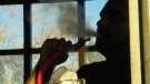 Man smoking hookah pipe in a hookah lounge.