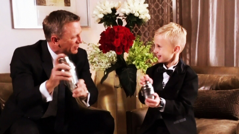 James Bond superfan Britton Walker, 8, from Calgary mixes an apple martini with actor Daniel Craig before the premiere of 'Spectre' in Mexico City. 