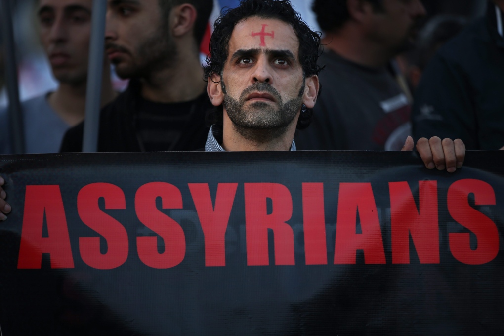 Assyrian man protests Christian abductions