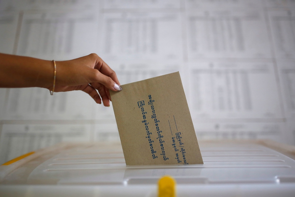 Voter casts ballot in Myanmar