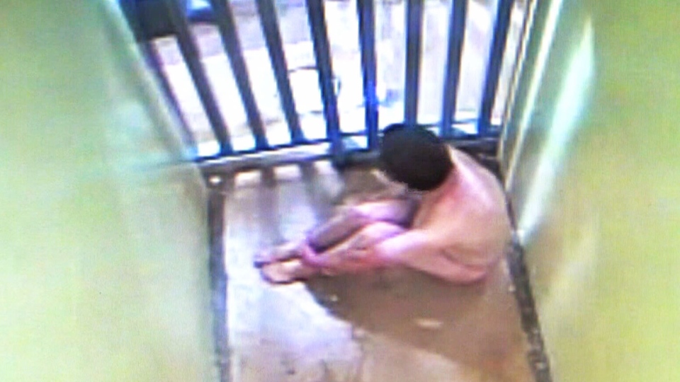 Donald Smith naked in police holding cell