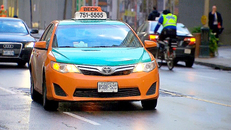 A Beck Taxi cab is seen driving in Toronto on Thursday, Nov. 19, 2015. 