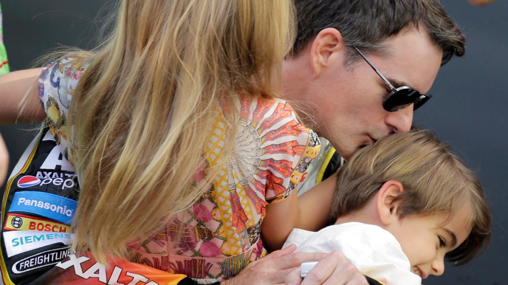 Jeff Gordon kisses his son Leo, carries Ella