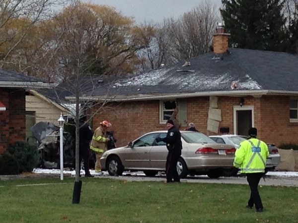 St. Thomas police and fire crews investigate after a car explosion on Wood Street in St. Thomas, Ont. (CTV London)