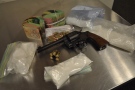 A handgun, ammunition, cash and drugs were seized by police after a search in London, Ont. on Monday, Nov. 23, 2015. (London Police Service)