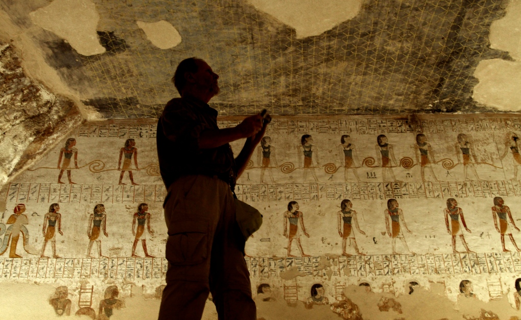 Tourist in King Merenptah's tomb in Egypt 