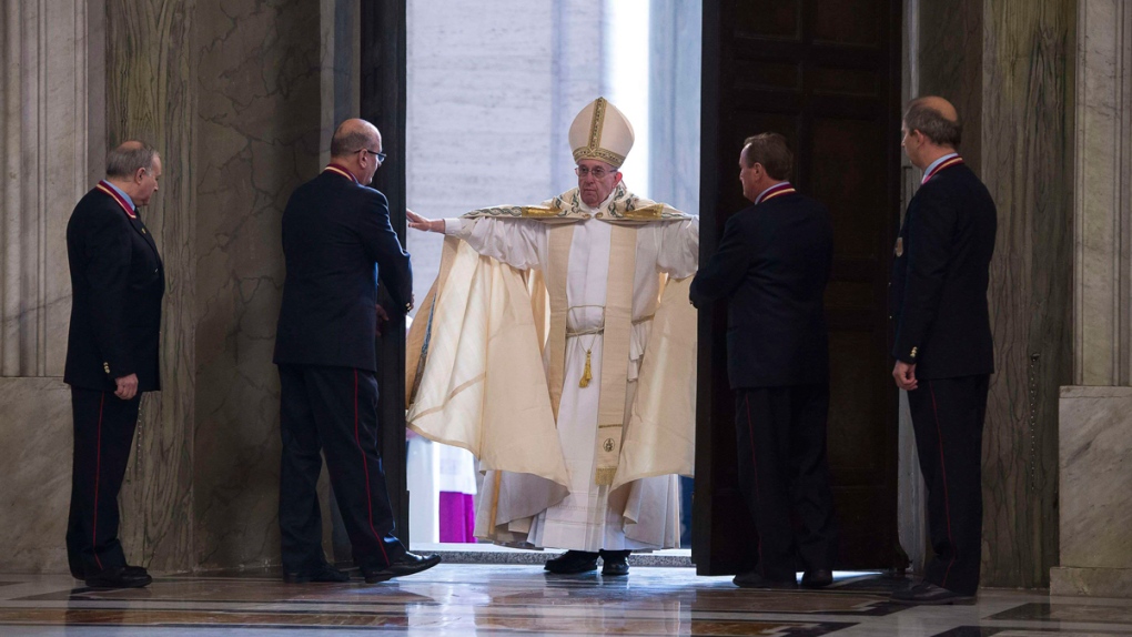 Pope Francis pushes open the Holy Door