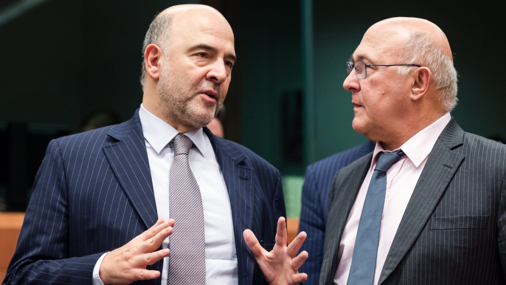 Michel Sapin, right, with Pierre Moscovici