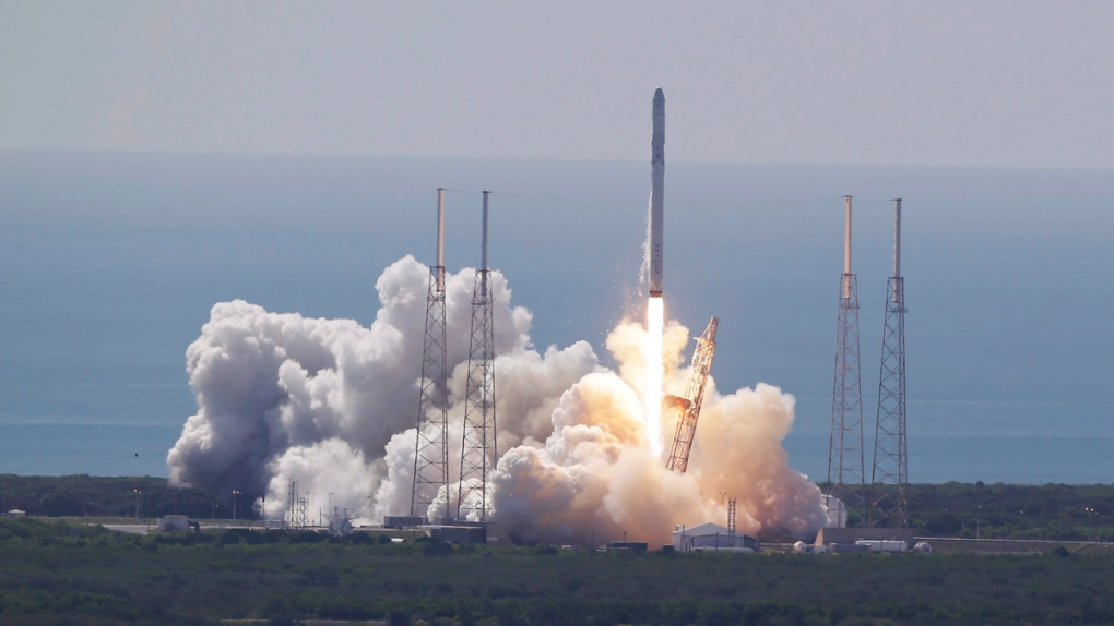 SpaceX Falcon 9 rocket and Dragon lift off
