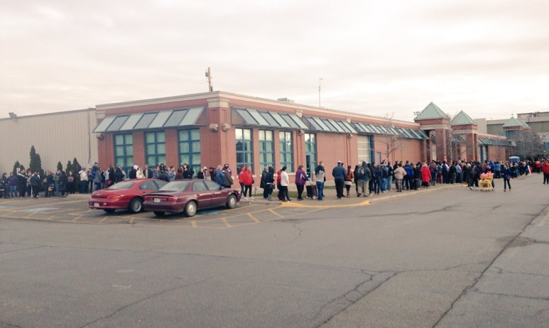 People waiting to pick up their Salvation Army Hamper line up at the Western Fair in London, Ont. on Monday, Dec. 14, 2015. (Gerry Dewan / CTV London)