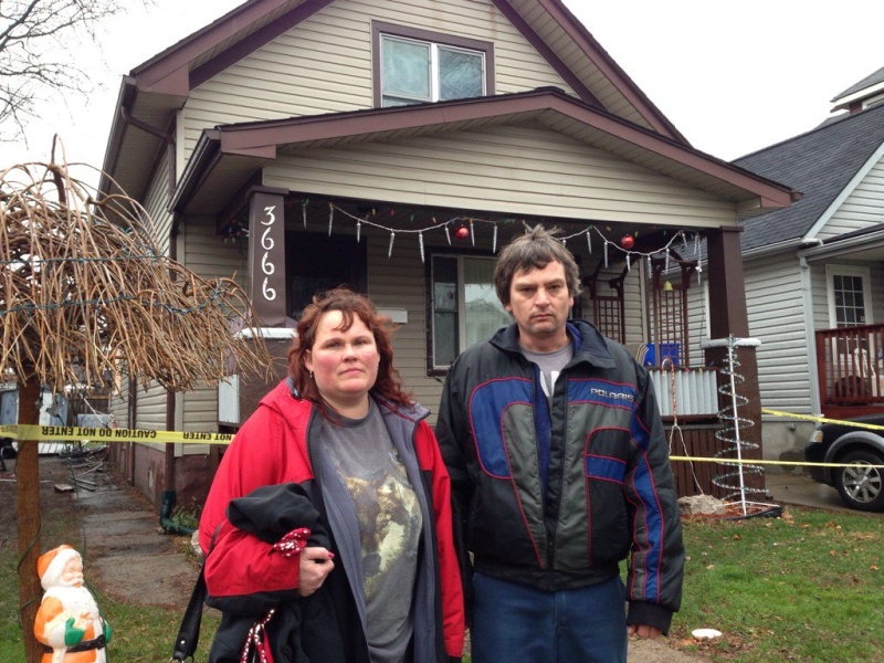 Gord and Jennifer Drummond are devastated after fire broke out at their house in Windsor, Ont., on Monday, Dec. 21, 2015. (Sacha Long / CTV Windsor)