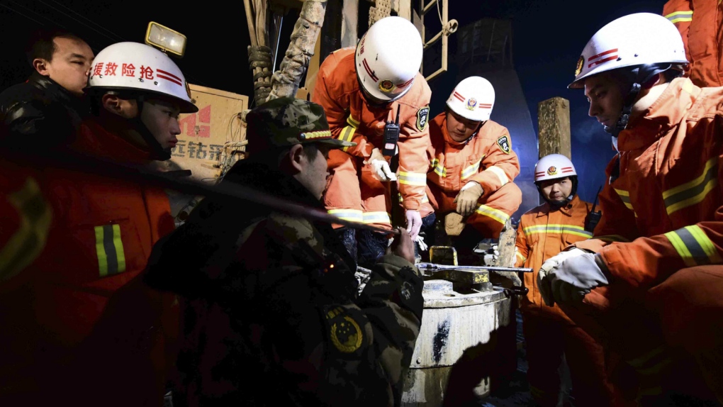 Officials look to rescue trapped miners