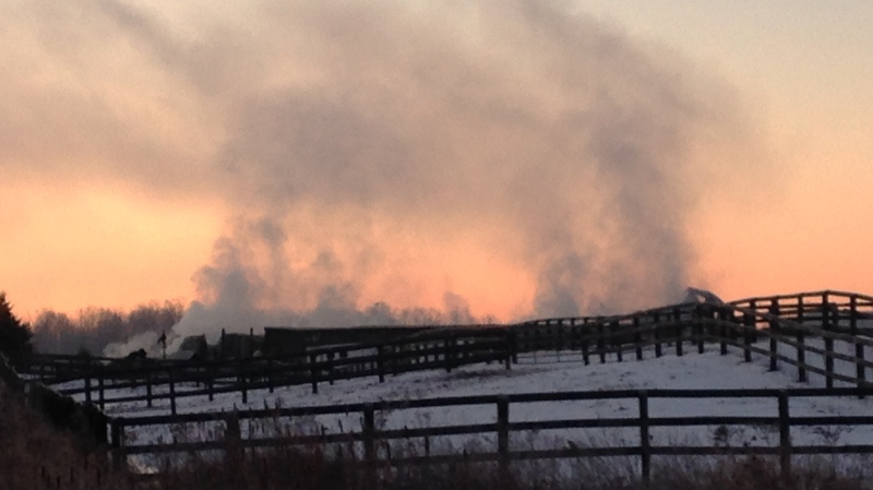 Smoke coming from the Classy Lane Stables Training Centre on Tuesday, Jan. 5, 2016, about eight hours after firefighters were first called to the property. (Jeff Pagett / CTV Kitchener)