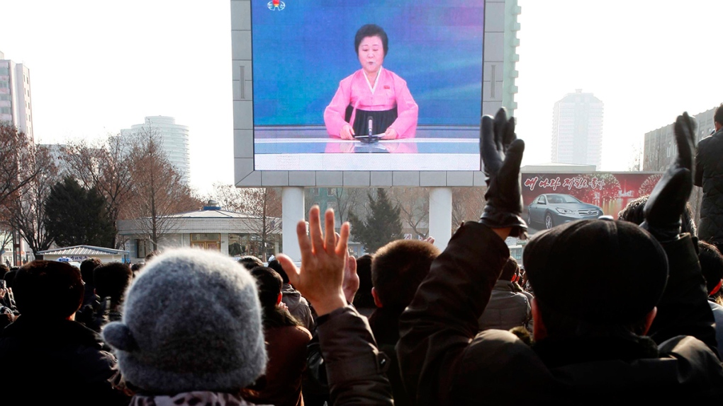 North Koreans watch announcement on nuclear test