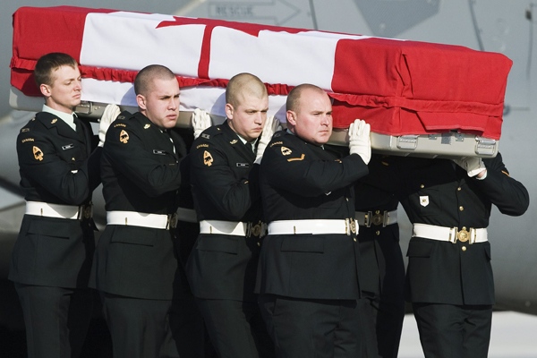 Military pallbearers carry the casket of Private Justin Peter Jones at CFB Trenton in Trenton, Ont., on Tuesday, December 16, 2008. (Nathan Denette / THE CANADIAN PRESS)