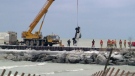 A pickup truck is hoisted out of Lake Huron after falling from Kincardine's north pier, killing its driver, on Saturday, Jan. 2, 2016.