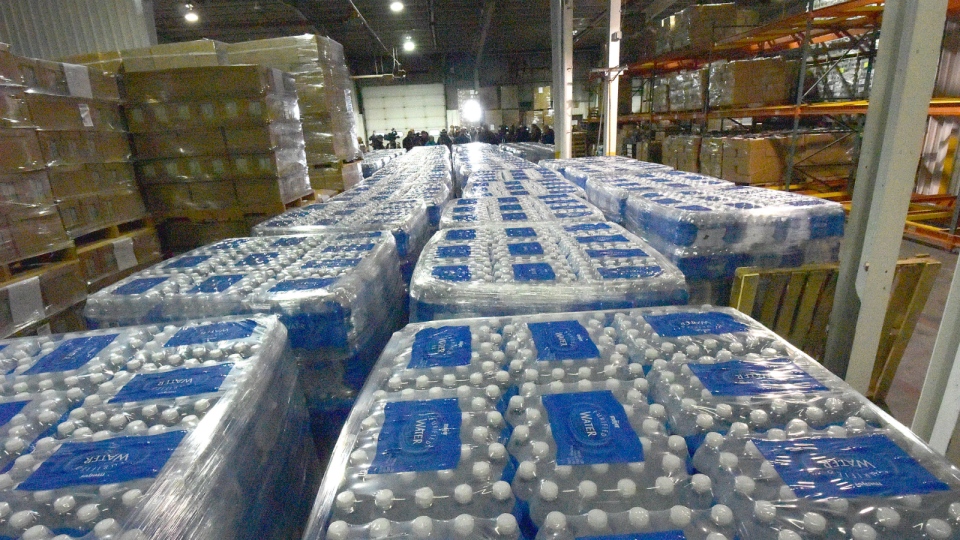 Bottled water await distribution in Flint