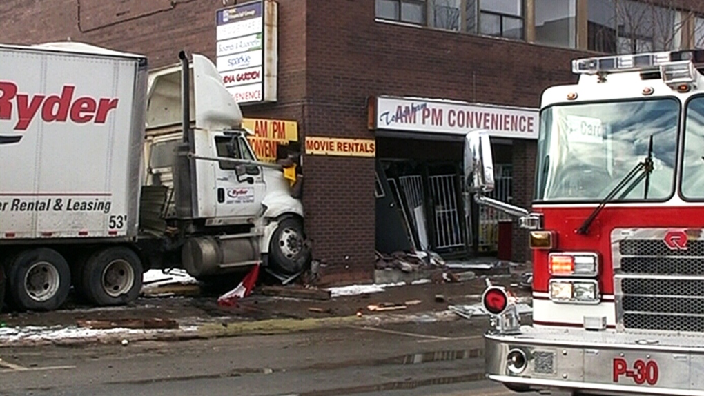 Truck smashes into buildings