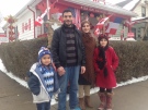 A Syrian refugee family stands in front of Canada Dan's house in Windsor, Ont., on Friday, Jan. 15, 2016. (Rich Garton / CTV Windsor)
