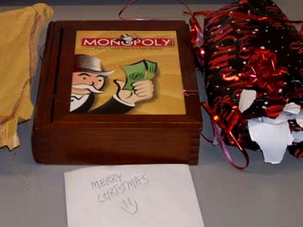 The package can be seen in its wrapping paper with a note saying "Merry Christmas."