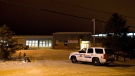 Police investigate the scene of a Friday afternoon shooting at the La Loche, Sask., junior and senior high school on Saturday, Jan. 23, 2016. The shooting left four people dead. THE CANADIAN PRESS/Jason Franson