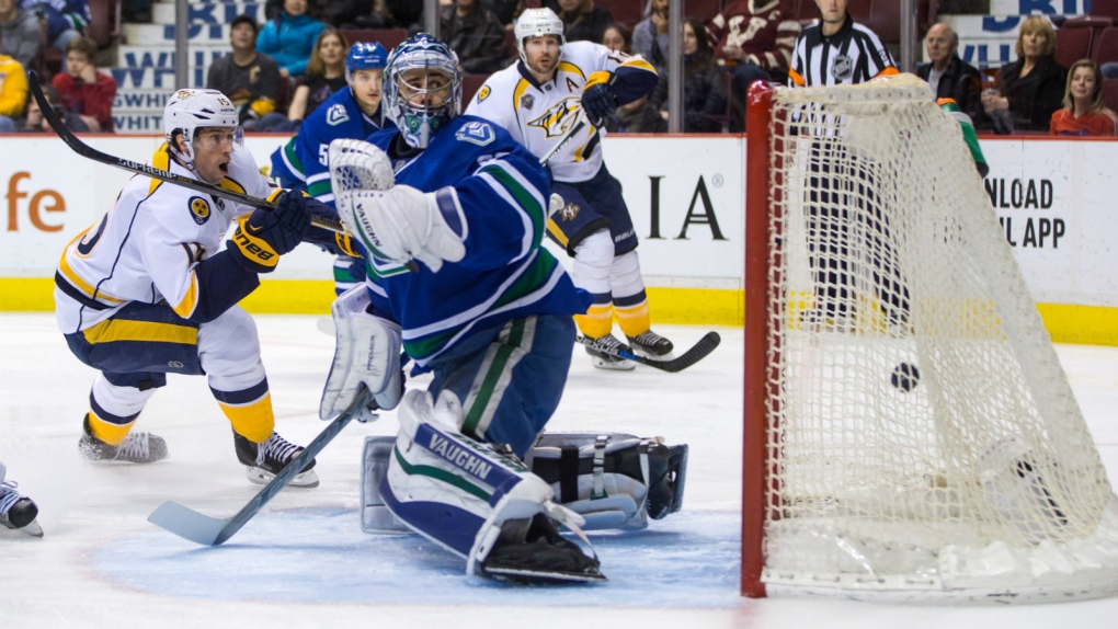 Craig Smith scores against the Vancouver Canucks
