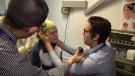 Dr. Darren Tse, the otolaryngologist who founded the Ottawa Hospital's Dizziness Clinic, assesses a patient.