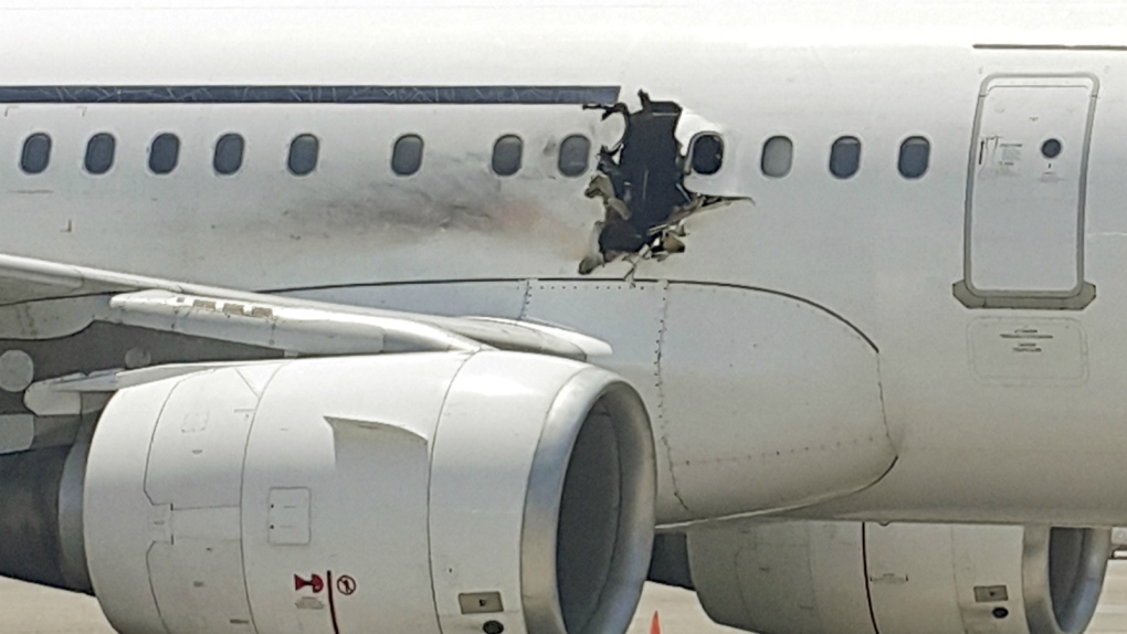 Bomb blows hole in side of jet in Somalia